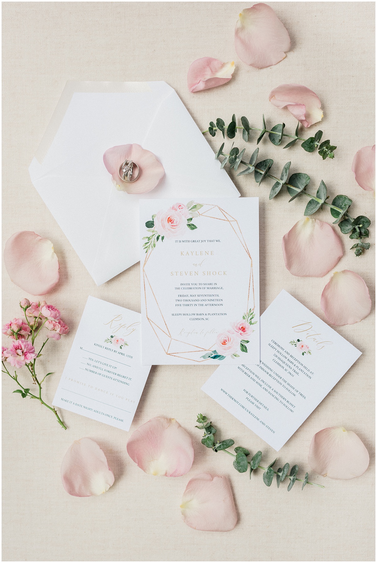 Blush inspired wedding invitation suite with greenery