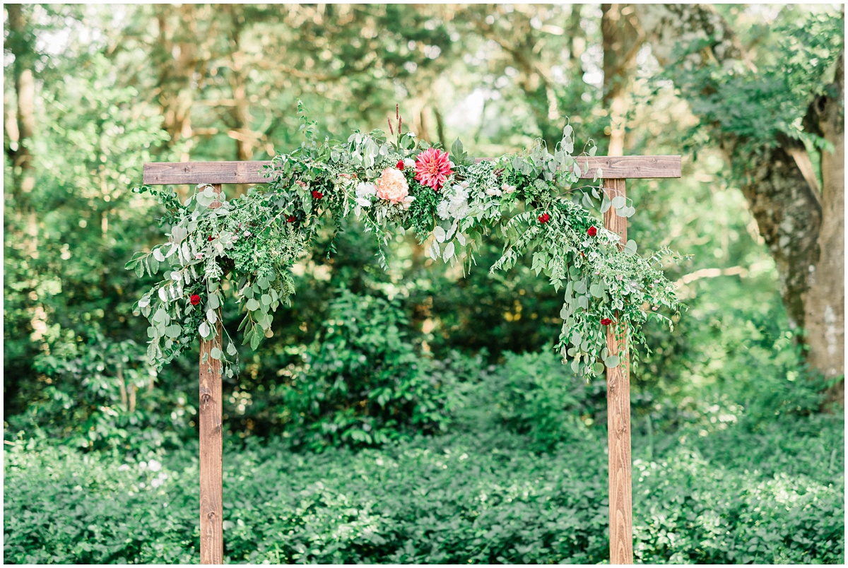 Wedding Ceremony Outdoor Arch with flowers and greenery
