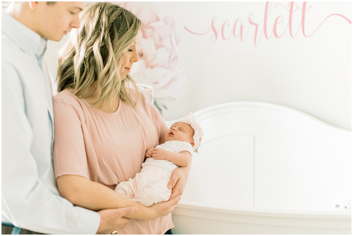 Greer newborn photographer, parents holding baby girl