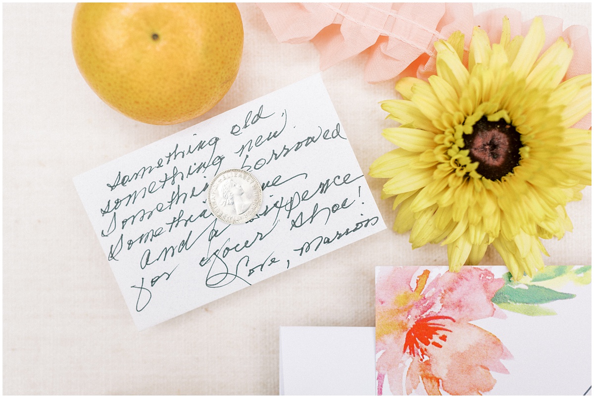 Bright peach and citrus themed wedding details