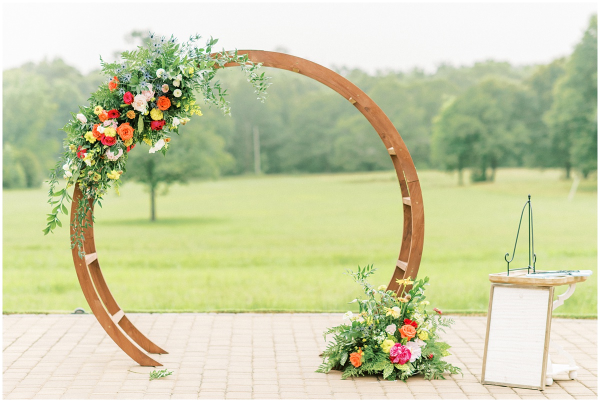 Peach and pink circle wedding arch flowers