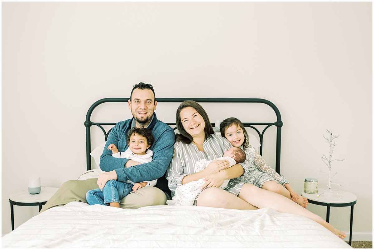 Greenville newborn photographer, family photo on bed