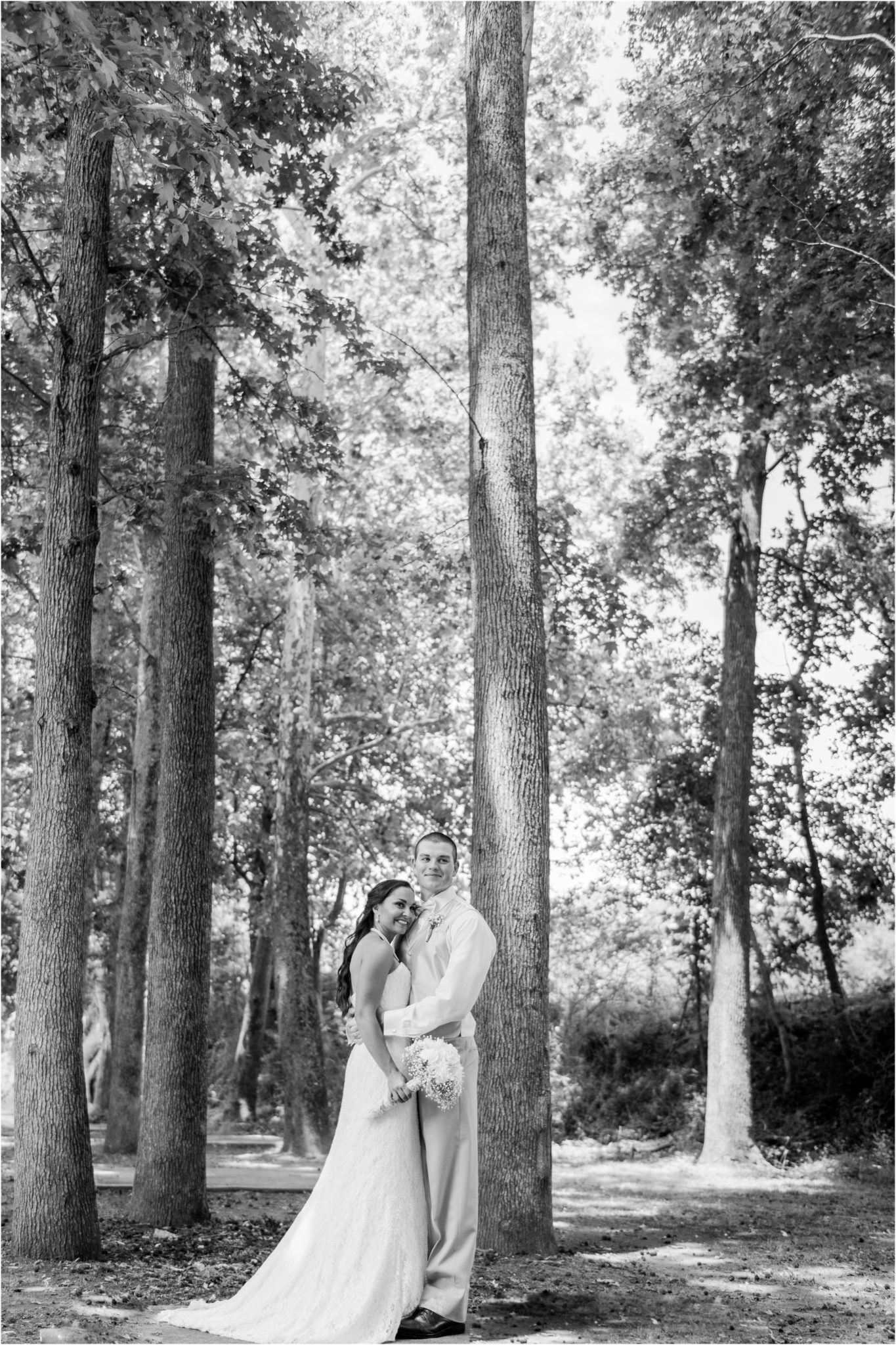Black and white bride and groom photo in the woods.