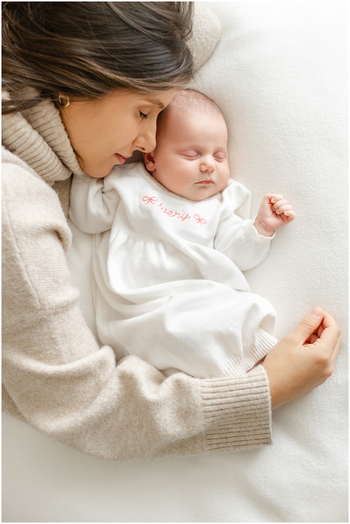 Mom laying with her newborn baby girl. Newborn photography in Greenville, SC.